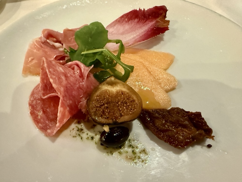 Prosciutto, salami, melon, and fig plate from the MDR on Zuiderdam