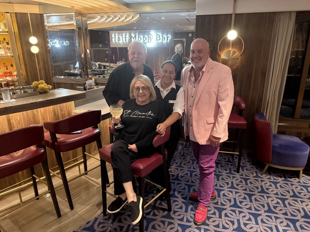 One final pic with two new cruising friends, Lowell and Linda, along with the Queen of Half Moon Bar - Reema