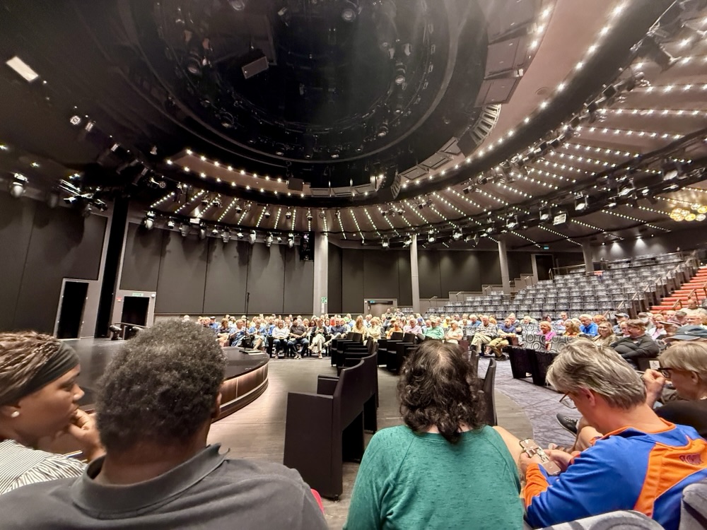 Back-to-back cruisers waiting in the World Stage to be taken to immigration