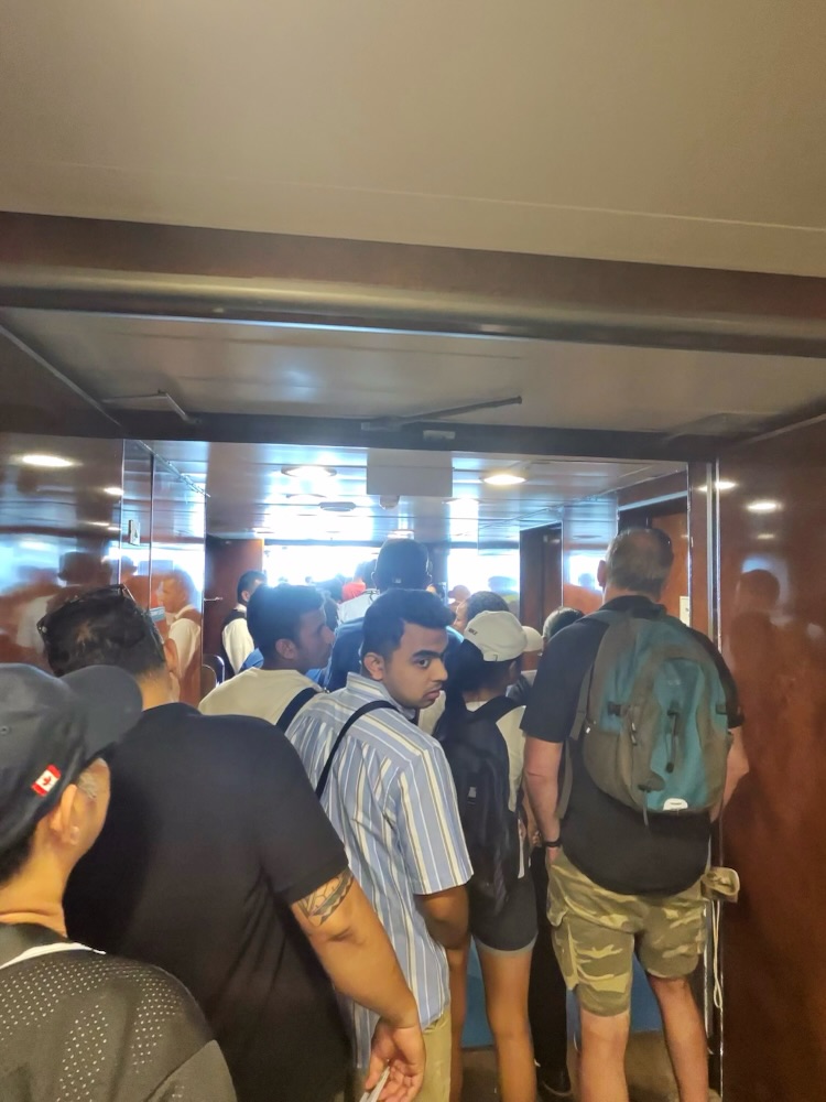 In line to board the tender for Belize