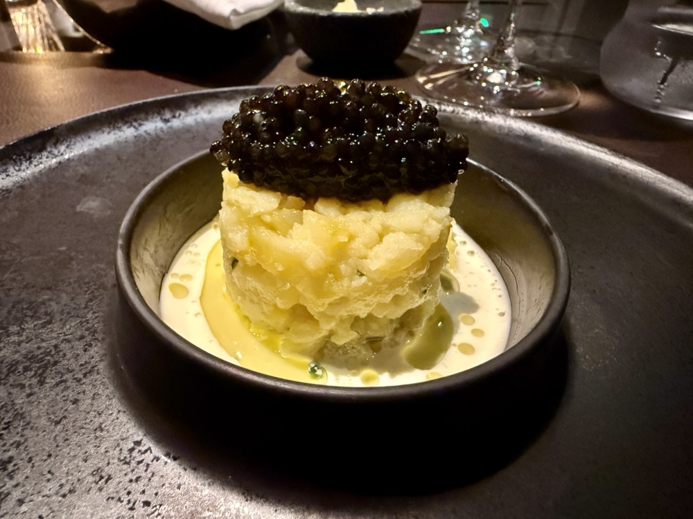 crushed fingerling potatoes & Normandy butter with chives, Calvisius Oscietra caviar from Marble & Company Grill on Explora Journeys