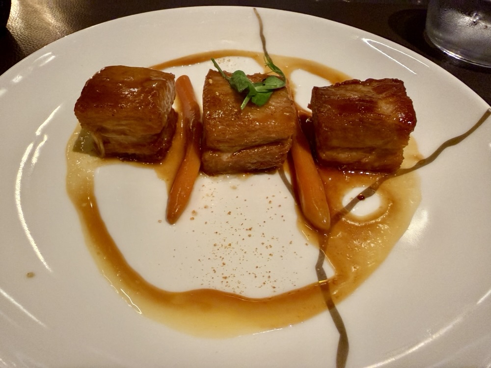 Slow cooked pork belly from Marble & Company Grill on Explora Journeys