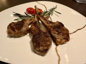 Sweet spice–grilled French lamb chops from Marble and Company Grill on Explora Journeys