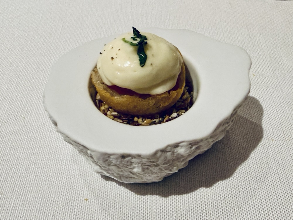 Amuse-bouche, a "hand pizza." from Anthology on Explore Journeys