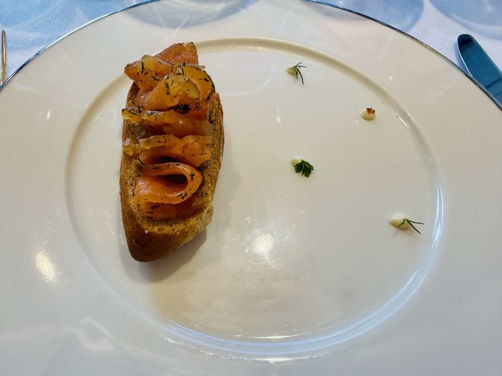 Toasted whole wheat bread, salmon gravlax from Anthology on Explora Journeys