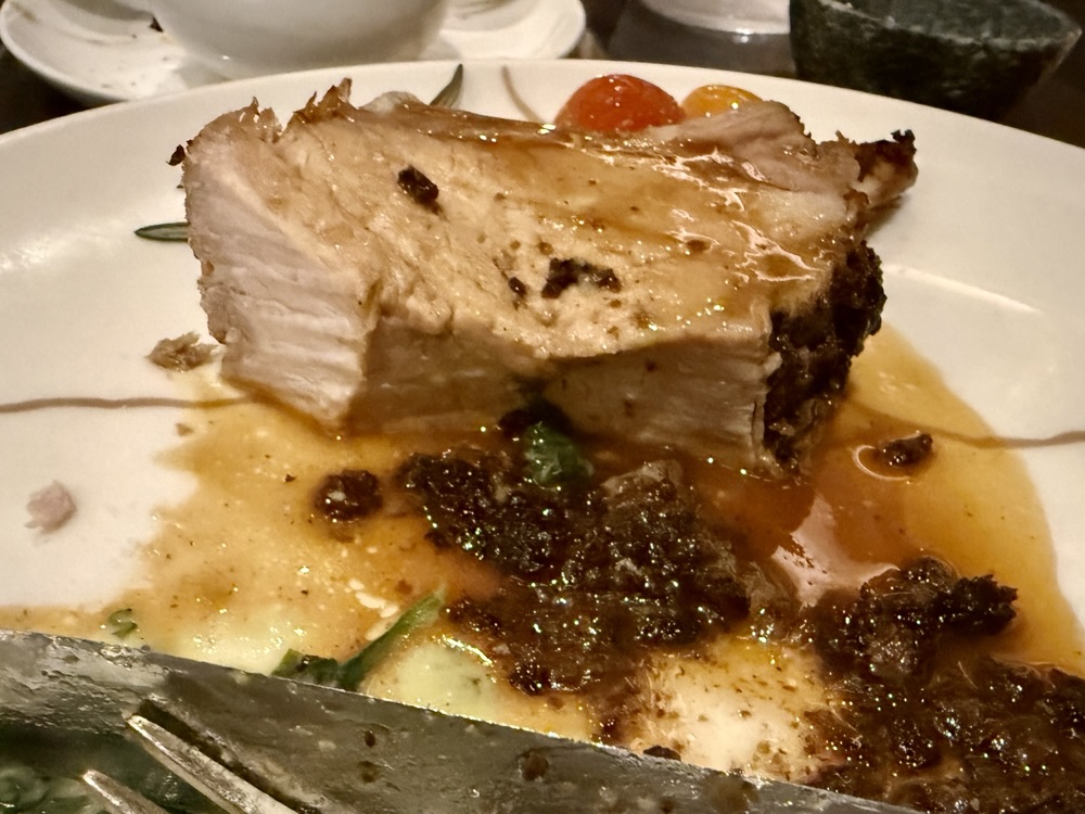 A very dry pork chop from Marble and Company Grill on Explora Journeys