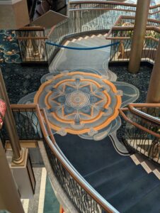 Waterfall staircase in the Grand Hall on the Disney Treasure