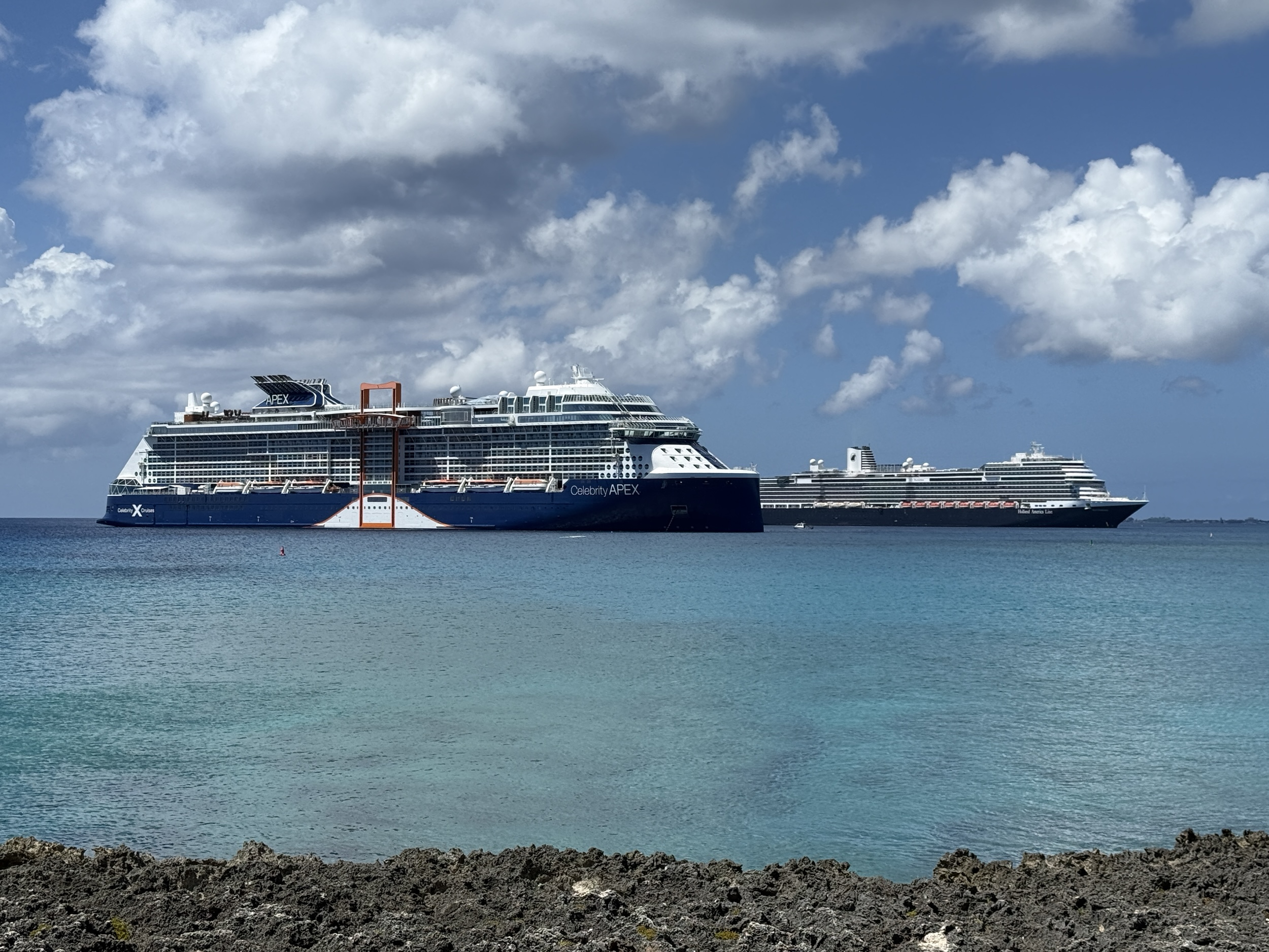 Celebrity Apex and Rotterdam at anchor in Grand Cayman on March 11, 2026