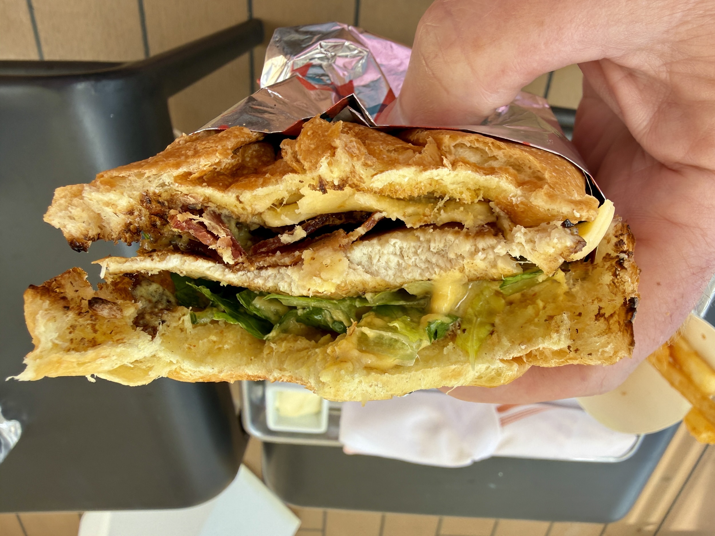 A very thin, grilled chicken sandwich from the Dive In on Rotterdam