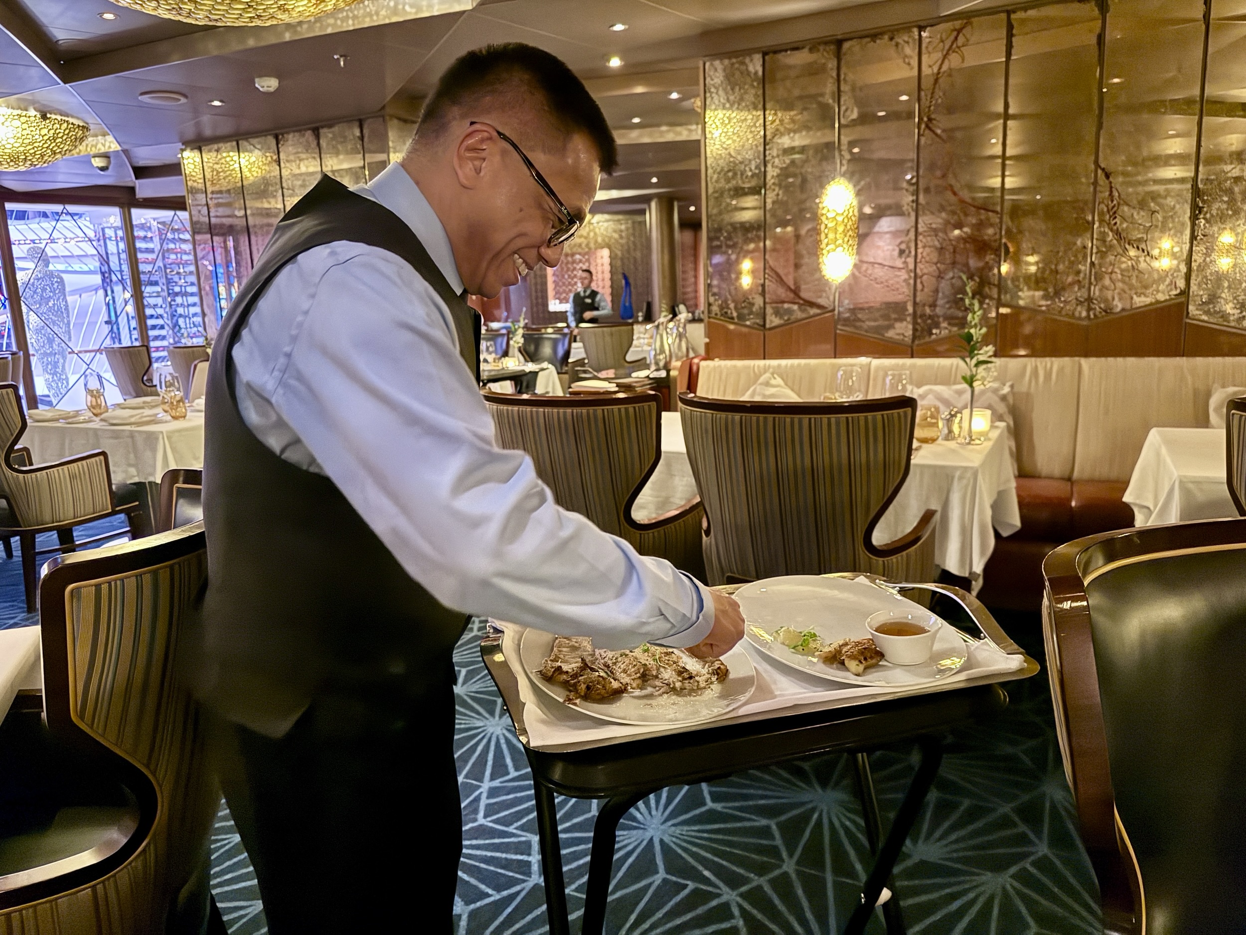 Dover Sole from Pinnacle Grill being prepared tableside on Koningsdam