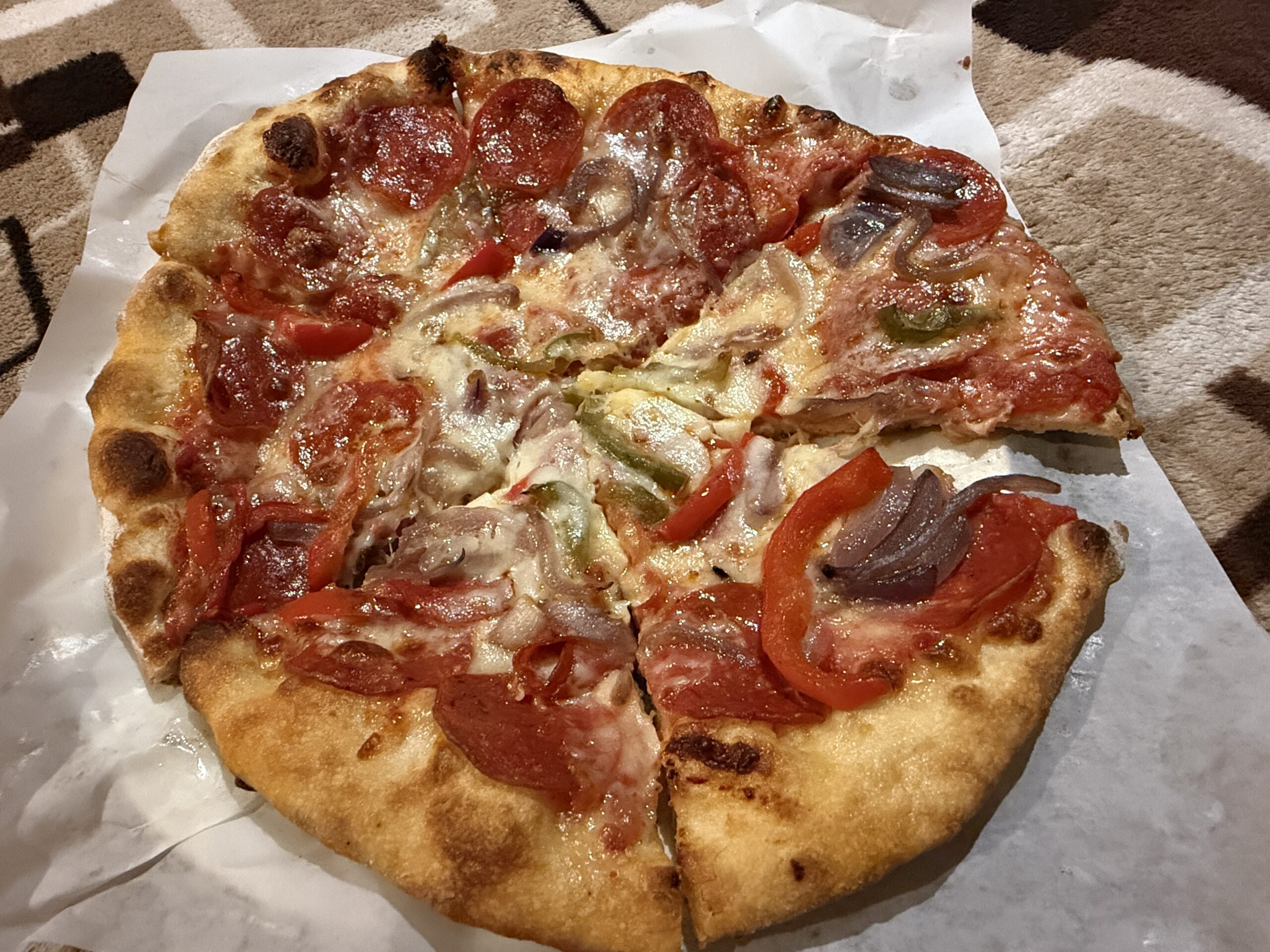 Pepperoni, onion, and peppers pizza from NY Pizza on Koningsdam