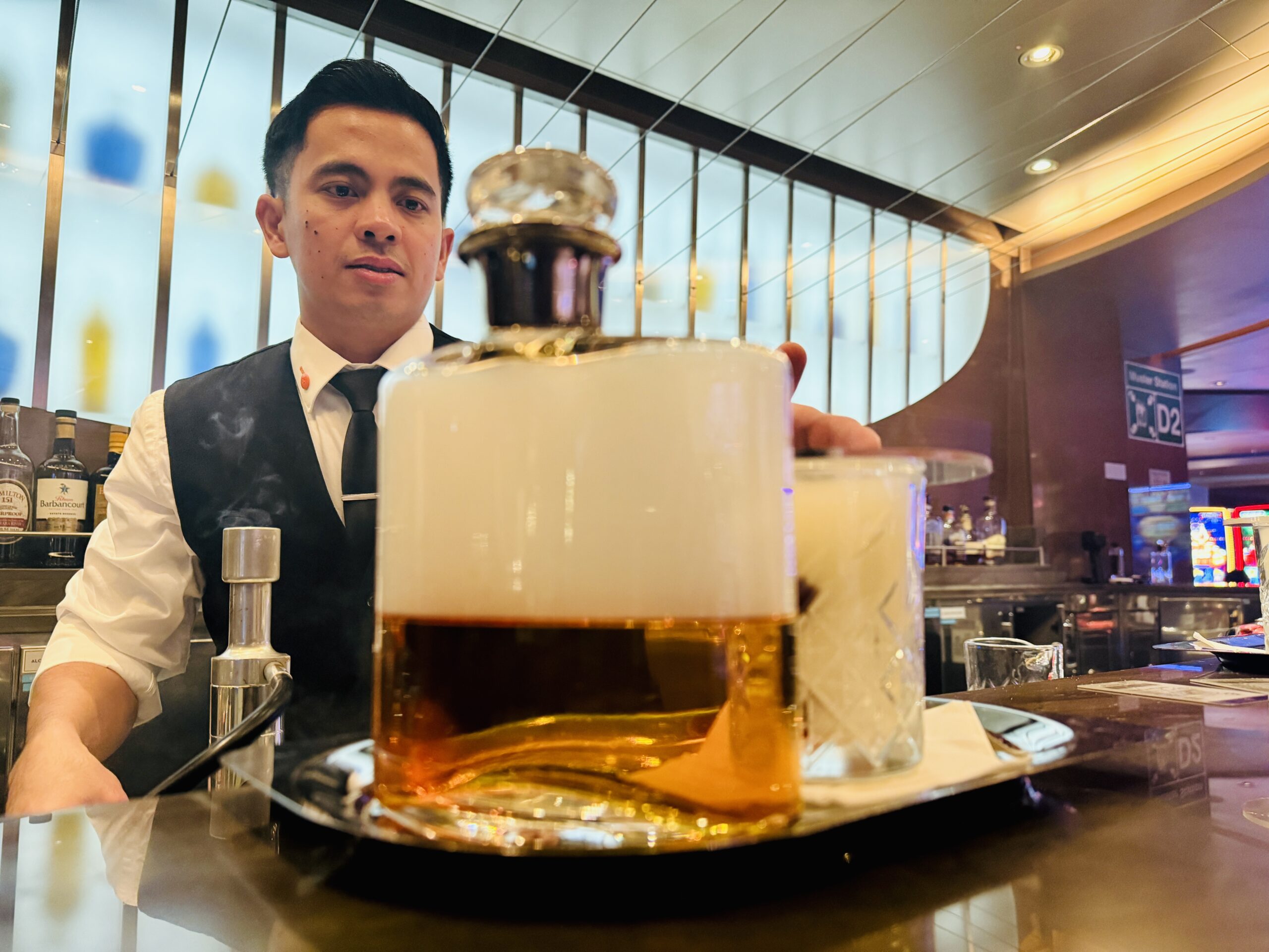 Mark from Ocean Bar making a smoked old fashioned on Koningsdam