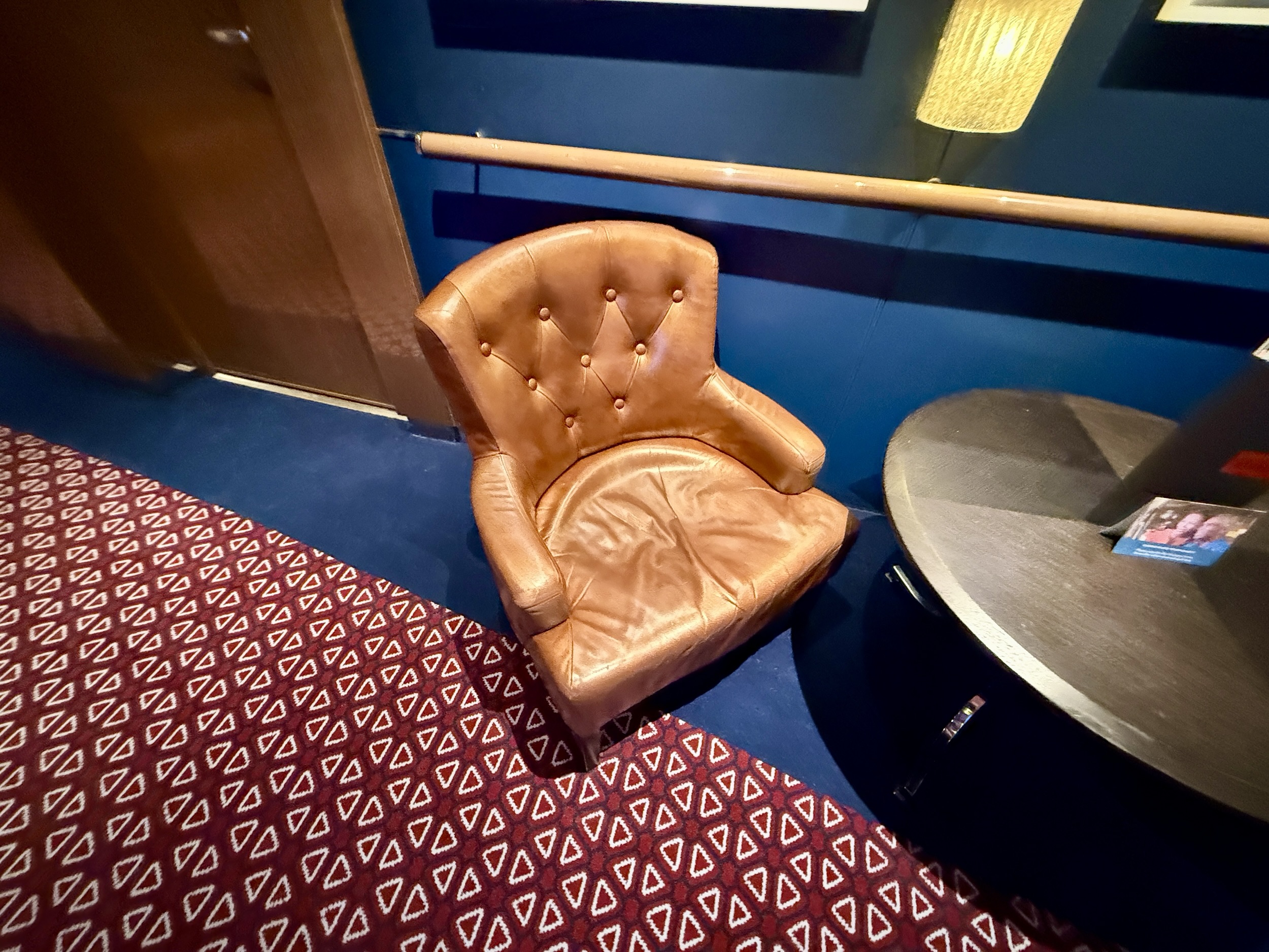 One of many chairs that could use a bit of restuffing on Koningsdam, post dry dock