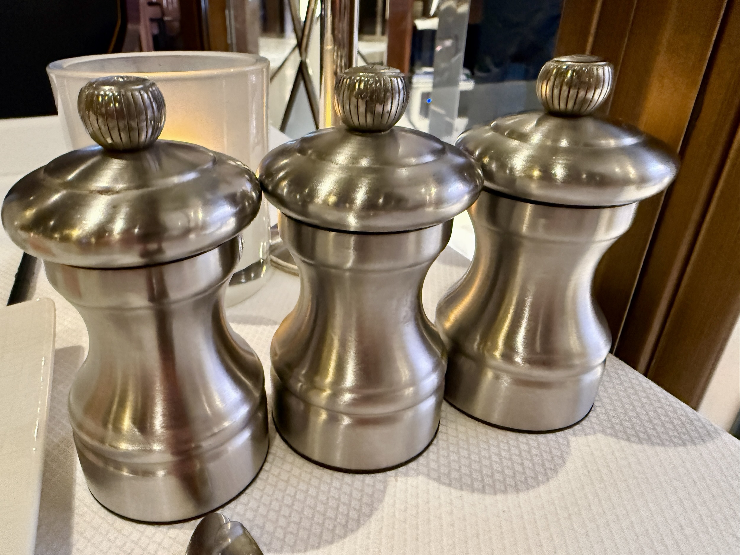 Three broken salt grinders.