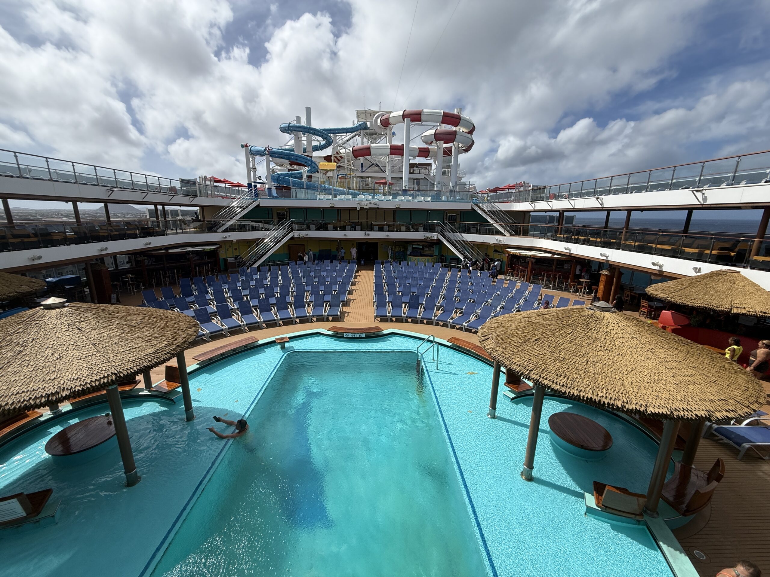 Cloudy skies over the Lido Pool on Carnival Horizon